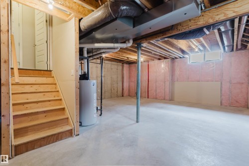 Unfinished basement with concrete flooring and exposed ceiling joists - 2921 Anderson Crest, Edmonton, AB 