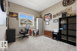 Neutral-toned walls complement the light-colored carpet flooring - 