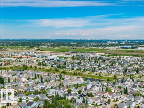 Aerial perspective of a developed residential area featuring numerous single-family homes with varying rooflines and exterior finishes - 71 3040 Spence Wynd, Edmonton, AB 