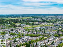 Residential neighborhood with a variety of single-family homes, mature trees, and green spaces - 