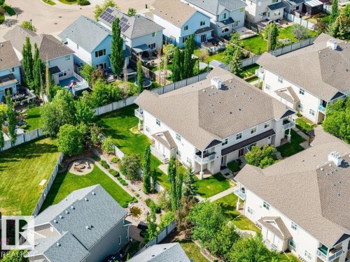 Aerial view showcasing a residential area with varied rooflines and green landscaping - 71 3040 Spence Wynd, Edmonton, AB 