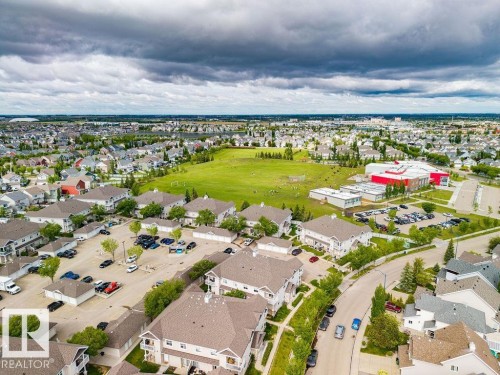 Aerial perspective showcasing a residential community with abundant green spaces - 71 3040 Spence Wynd, Edmonton, AB 