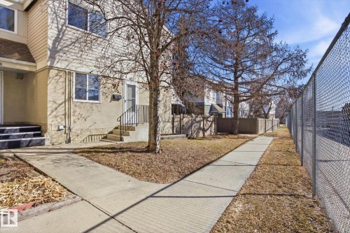 Two-story townhouse exterior with stucco and siding finishes - 857 Erin Place, Edmonton, AB 
