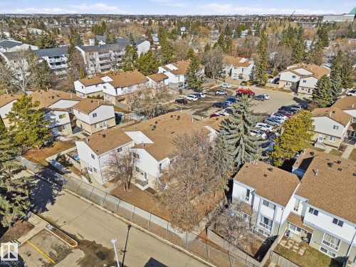 Aerial perspective showcasing a residential community with multiple townhouse-style units - 857 Erin Place, Edmonton, AB 