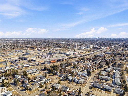 Aerial perspective showcasing a sprawling urban landscape with a distant city skyline under a clear sky - 857 Erin Place, Edmonton, AB 