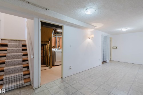 Finished interior space featuring light-toned square tile flooring - 4 14310 80 Street, Edmonton, AB 