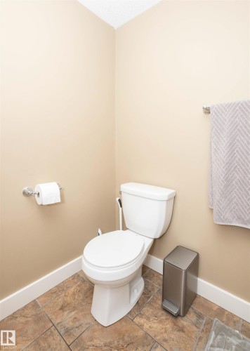 Neutral-toned walls complementing multi-toned tile flooring - 10232 101 Street, Westlock, AB 