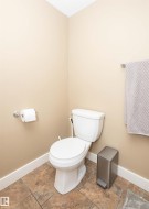 Neutral-toned walls complementing multi-toned tile flooring - 
