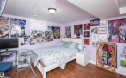 Finished room featuring wood-finish flooring, drop ceiling, and a single window - 