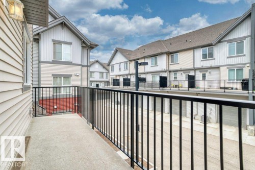 Private balcony featuring a concrete surface and black metal railings - 125 655 Watt Boulevard, Edmonton, AB 