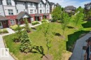 Multi-level residential buildings featuring red and gray siding - 125 655 Watt Boulevard, Edmonton, AB 