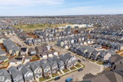 Expansive neighborhood showcasing numerous detached residences with varied exterior finishes and attached garages - 