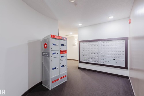 Interior mailroom featuring individual mailboxes and parcel lockers - 402 3670 139 Avenue, Edmonton, AB 