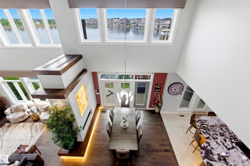 Two-story living area with abundant natural light from multiple windows - 9003 16 Avenue, Edmonton, AB 