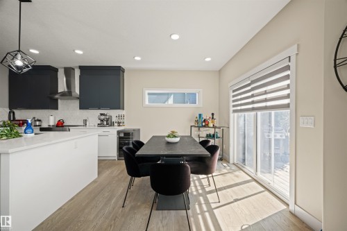 Spacious kitchen and dining area with light wood-finish flooring - 12171 177 Avenue, Edmonton, AB 