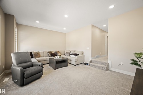 Spacious living area featuring neutral wall tones and plush carpeting - 12171 177 Avenue, Edmonton, AB 