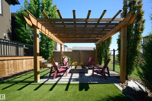 Outdoor pergola with a paver patio and built-in fire pit - 12171 177 Avenue, Edmonton, AB 