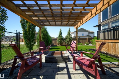 Outdoor living space featuring a wood pergola and a paved patio - 12171 177 Avenue, Edmonton, AB 