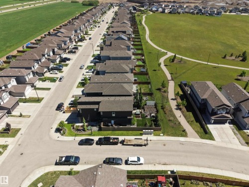 Residential street with uniform housing, featuring a paved roadway and concrete sidewalks - 12171 177 Avenue, Edmonton, AB 