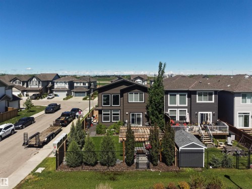 Modern two-story residence with a dark exterior and white trim windows - 12171 177 Avenue, Edmonton, AB 
