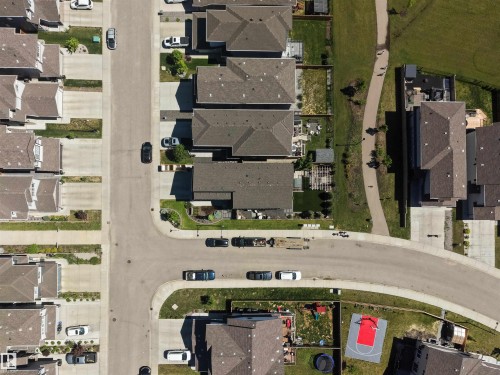 Aerial perspective showcasing a residential street with homes featuring dark shingle roofs - 12171 177 Avenue, Edmonton, AB 