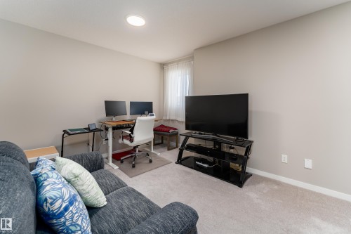 Room featuring light gray carpet flooring and neutral wall tones - 2520 152 Avenue, Edmonton, AB 