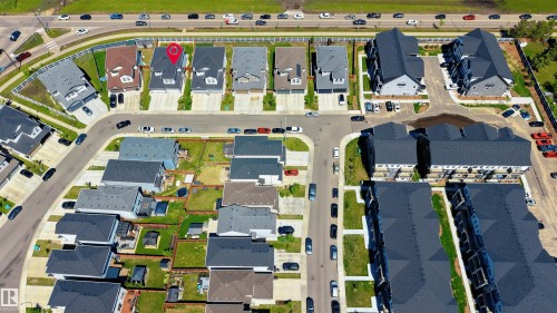 Residential property featuring a two-story structure with a gabled roof, a front-facing garage, and a driveway - 2520 152 Avenue, Edmonton, AB 
