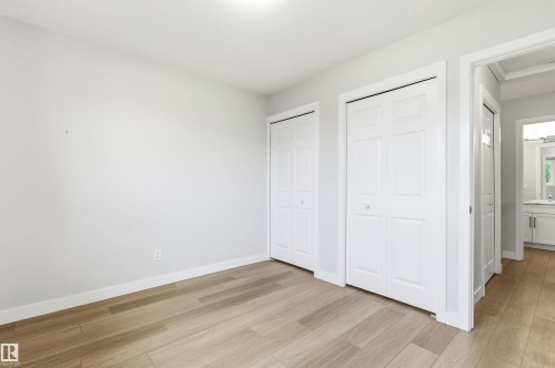 Bright interior space featuring light wood-finish flooring - 18353 66 Avenue, Edmonton, AB 