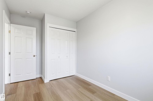 Interior room featuring wood-finish flooring - 18353 66 Avenue, Edmonton, AB 