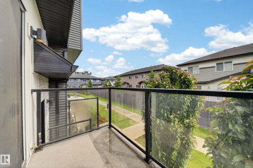 Private balcony with concrete flooring and contemporary glass panel railing - 52 1729 Keene Crescent, Edmonton, AB 