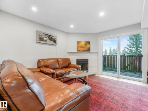550 Lakewood Road Nw, Edmonton, AB - Indoor Photo Showing Living Room With Fireplace