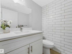 Half bathroom all renovated including elegant tile wall. - 