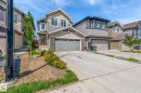 Contemporary two-story residence featuring a combination of horizontal siding and stone veneer - 17562 63A Street, Edmonton, AB 