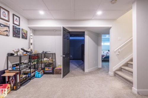 Plush carpeted flooring throughout, recessed lighting, white paneled ceilings, and trim detailing - 17562 63A Street, Edmonton, AB 