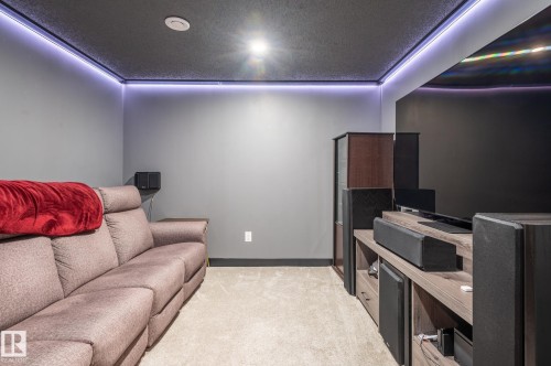 Media room featuring a dark ceiling, recessed lighting, and perimeter cove lighting - 17562 63A Street, Edmonton, AB 