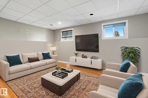 Finished lower level featuring recessed lighting and wood-finish flooring - 14239 53 Street, Edmonton, AB 