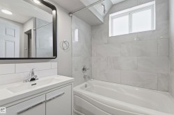 Modern bathroom vanity with integrated sink and chrome faucet - 