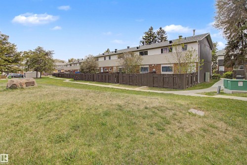 Expansive green space featuring a walking path and mature trees - 5724 143 Avenue, Edmonton, AB 