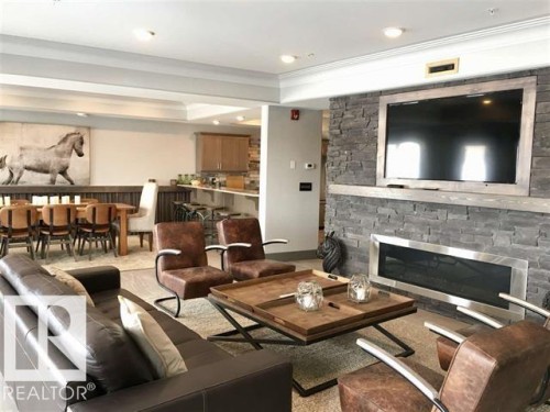 #302 5201 Brougham Dr, Drayton Valley, AB - Indoor Photo Showing Living Room With Fireplace