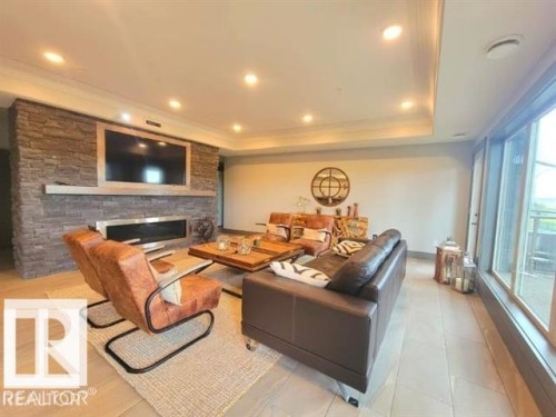 #302 5201 Brougham Dr, Drayton Valley, AB - Indoor With Fireplace