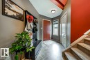 Welcoming entry featuring a red front door, tiled flooring, and a window with blinds - 8507 2 Avenue, Edmonton, AB  - Indoor Photo Showing Other Room 