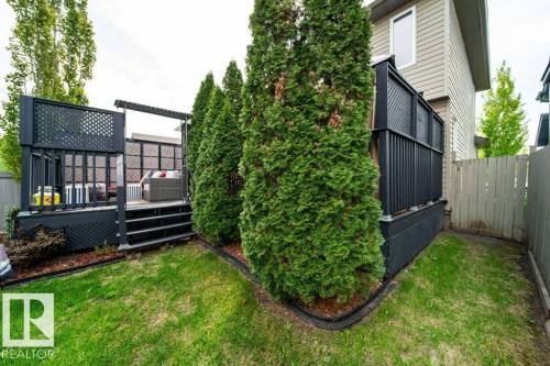 Raised deck with dark-stained wood railings and lattice accents - 8507 2 Avenue, Edmonton, AB - Outdoor With Deck Patio Veranda