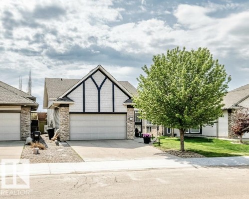 Gable-front exterior featuring decorative half-timbering and shingle siding - 71 Ridgehaven Crescent, Sherwood Park, AB 