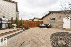 Expansive paver patio with a wood-finish composite deck - 