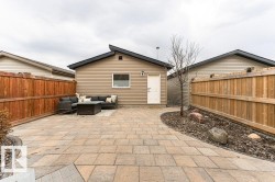 Expansive paved patio area featuring multi-toned paver stones - 