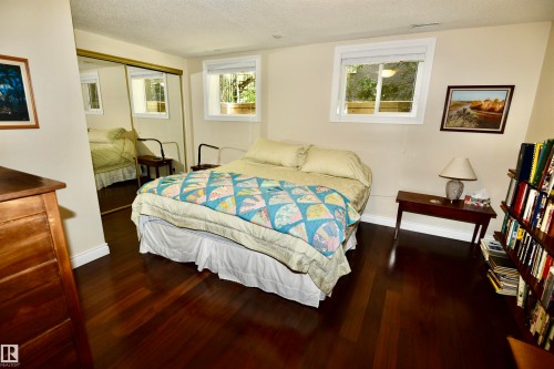 Rich wood-finish flooring complements the neutral wall tones - 6 St George'S Crescent, Edmonton, AB 