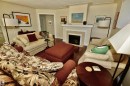 Living area featuring wood-finish flooring, a white mantel, and a built-in fireplace - 6 St George'S Crescent, Edmonton, AB 