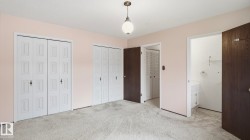 Carpeted room with light pink walls - 