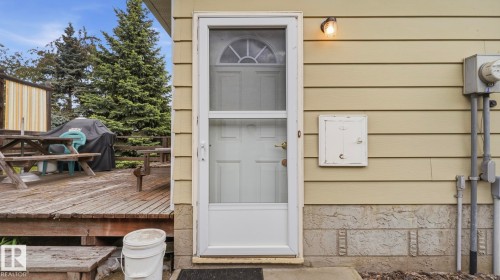 Wood-finish deck with steps and mature trees - 7408 40 Avenue, Edmonton, AB 