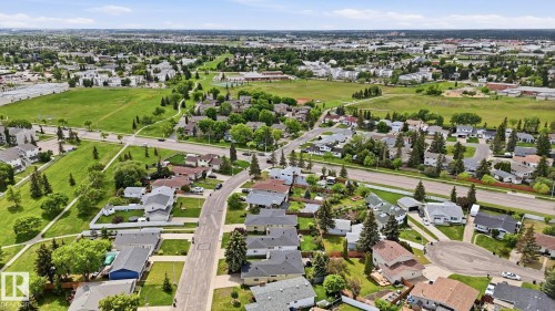 Residential neighborhood with detached homes, mature trees, and expansive green spaces - 7408 40 Avenue, Edmonton, AB 